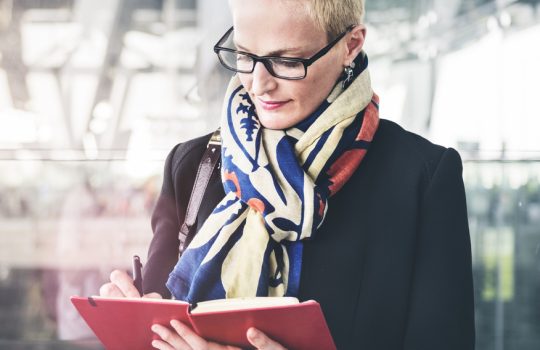 Businesswoman Writing Waiting Flight Concept